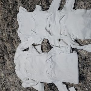 Bundle of white onesies.